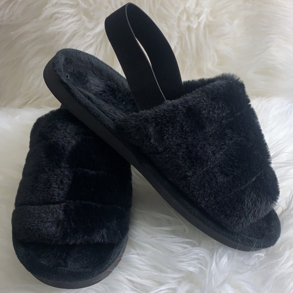 Black furry slippers